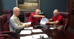 Bob and Ben signing the papers turning The LeverEdge to an ESOP